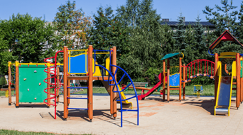 a playground with slides and other toys in a park